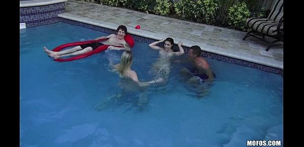  Two slutty skinny dipping girlfriends start orgy at a pool party